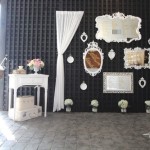 A vintage origami table in a black and white room for a Quinceanera celebration.