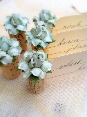 Quinceanera floral bouquet table with three wine corks filled with flowers