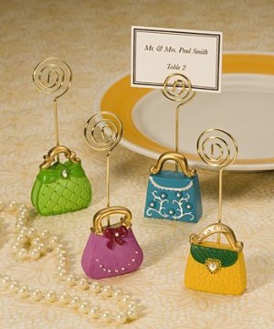 A plate with a bunch of small purses on it, representing Quinceanera party favors