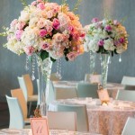 Table with flower vases for Quinceanera, featuring a bunch of flowers