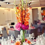 A beautiful Quinceanera floral centerpiece with gladiolus flowers on a table