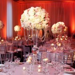 Centrepiece, a Quinceanera reception with white flowers and candles