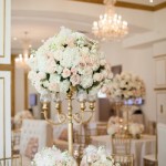 Quinceanera centrepiece, a table topped with lots of white flowers