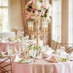 Quinceanera centrepiece Table, a table set for a Quinceanera reception with pink and white flowers