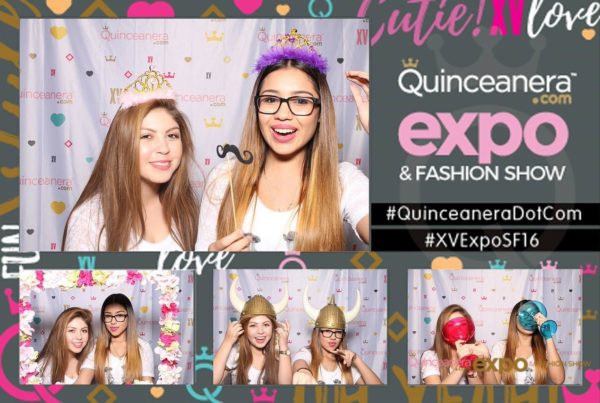 A group of women posing for a photo booth at a Quinceanera beauty fashion event.