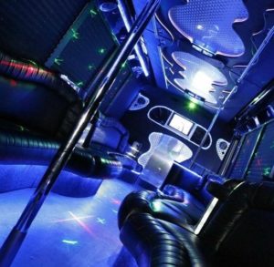 A Quinceanera party bus with blue lights decorated in a celebrity style
