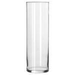 A Quinceanera-themed highball glass by Libbey, placed next to a tall glass vase with a white lid