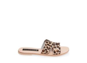 A pair of leopard print sandals on a white background, perfect for a Quinceanera