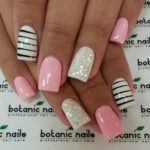 Quinceanera image: Pretty spring nail designs - a woman's hand with a pink and white manicure