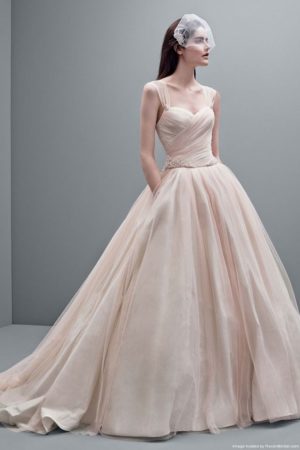 Quinceanera dress, a woman in a Quinceanera dress posing for a picture