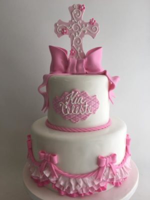 Quinceanera cake decorating Cupcake, a white and pink cake with a cross on top