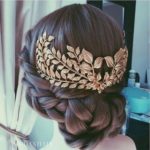 A close up of a person with a hair comb, showcasing a Quinceanera hairstyle