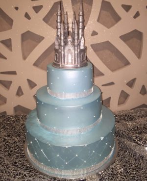 Quinceanera cake, a three tiered cake with a castle on top