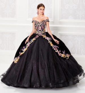 A woman in a black and gold ball gown, wearing Quinceañera dresses