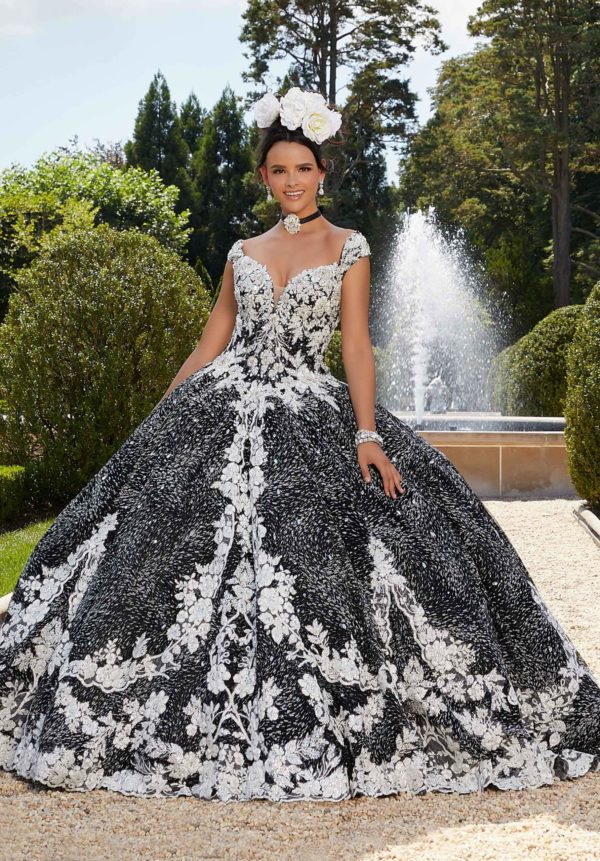 A woman wearing a black and white Quinceañera dress (34042)