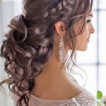 Quinceanera, a woman with long hair in a strapless dress, showcasing prom long hair hairstyles