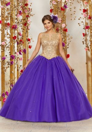 A young girl wearing a purple and gold gown Quinceañera dress