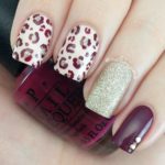 A Quinceanera themed image featuring nail designs. The image shows a person holding a manicure with a leopard print on it.