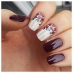 Quinceanera nail art, a person holding a purple and white manicure