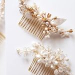 A Quinceanera-themed image featuring body jewelry and a pair of hair combs displayed on a table.
