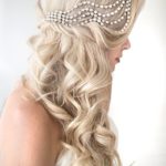 A Quinceanera-themed image of a woman with long blonde hair wearing a headband in an art deco hairstyle