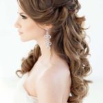 Quinceanera: A woman in a white dress with long hair, showcasing a beautiful hairstyle.