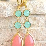 A close up of a pair of Quinceanera earrings