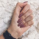 Quinceanera: A woman's hand holding a purple manicure with เล็บ สี นู้ ด ม่วง text
