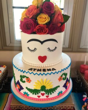 Cake decorating, a Quinceanera cake decorated with flowers and a fridable