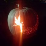 A Quinceanera-themed Jack-o'-lantern, featuring a lighted pumpkin with a star on it