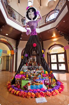 Decoracion Altar de Muertos Ofrenda, featuring a large statue of a woman in a dress for a Quinceanera celebration