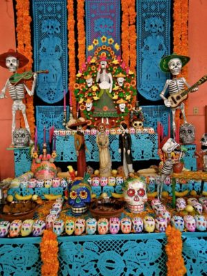 Quinceanera image: A Quinceanera-themed altar decorated with sugar skulls for Dia de Muertos (Day of the Dead)