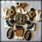 A bunch of cookies on a table at a Quinceanera celebration