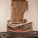 A three tiered Quinceanera cake with a clock on top, inspired by the 1920s.