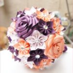 A Quinceanera flower bouquet, featuring a mix of purple and orange flowers