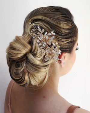 Quinceanera headpiece hairstyle: a woman with a hair comb in her hair