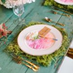 A Quinceanera-themed table set with porcelain plates
