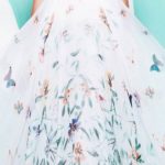 Quinceanera dress, a woman in a white dress with flowers on it