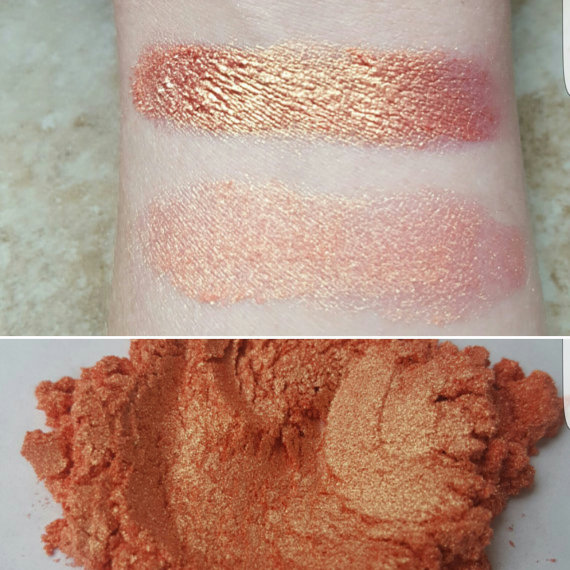 A close up of a person's arm holding a spoon, with lip makeup