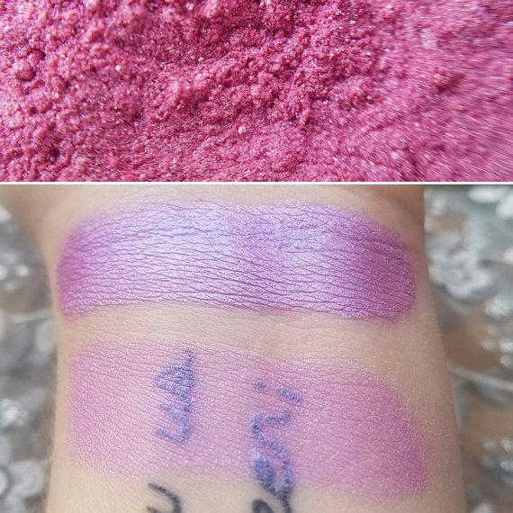 A close up of a person's arm with lilac lipstick and pink powder on it, Quinceanera