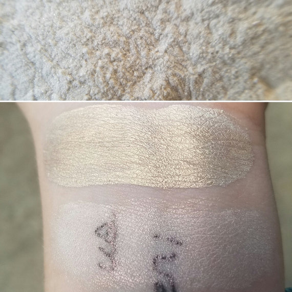 Close up of a person's arm with a Quinceanera-themed tattoo and nail makeup