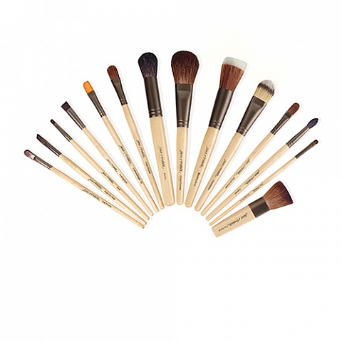 A Quinceanera themed image of a Jane Iredale kit paintbrush and a bunch of brushes stacked on top of each other