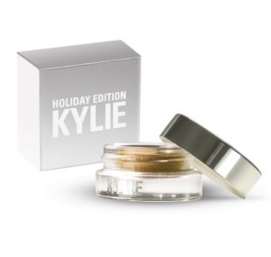 A Quinceanera-themed image featuring a ring from Kylie Cosmetics and a small jar of eyeliner next to a box.