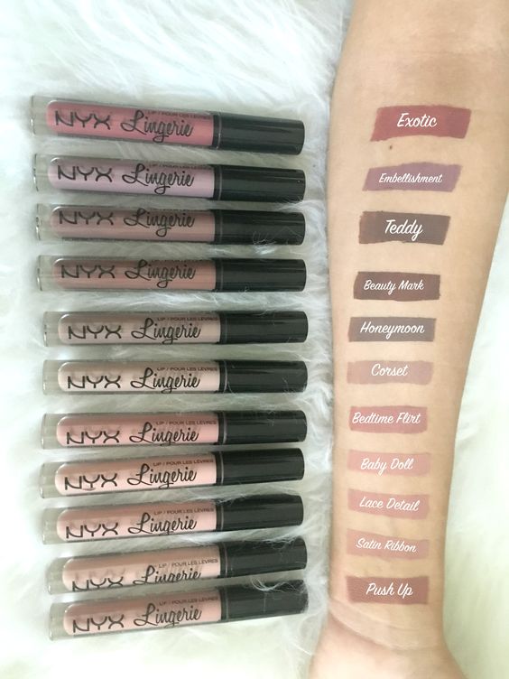 A person holding a bunch of Quinceanera-themed NYX Lip Lingerie lipsticks