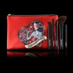 An image of Reina Rebelde makeup brushes and a red bag for Quinceanera