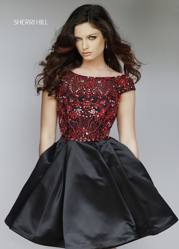 Quinceanera fashion model wearing a black and red dress