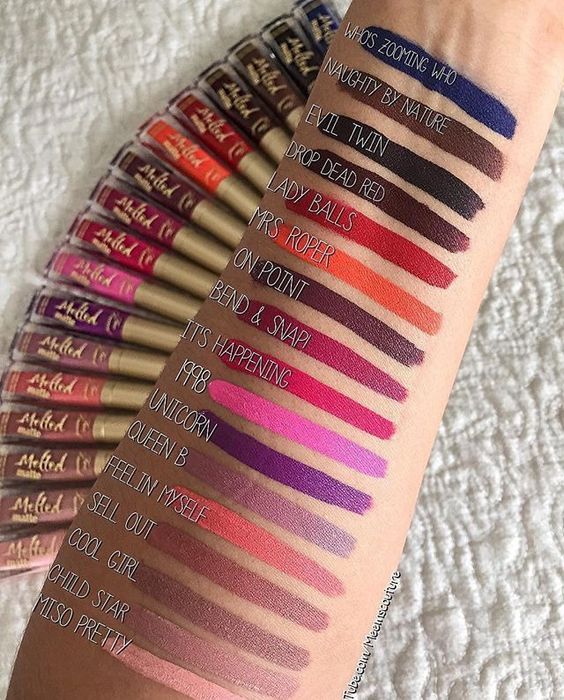 Close up of a person's arm with Too Faced Melted Matte Liquified Lipstick swatches