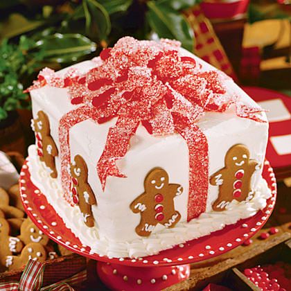 A Quinceanera-themed chocolate cake decorated with gingerbreads and a bow