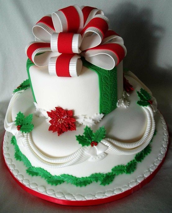 Quinceanera cake, a pretty white cake with a red and green bow on top