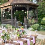 A Quinceanera gazebo is set up in the middle of a garden